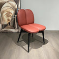 Modern Double-Lobed Leather Chair – Vibrant Orange-Red Upholstery with Black Tapered Legs – Contemporary Lounge Seating